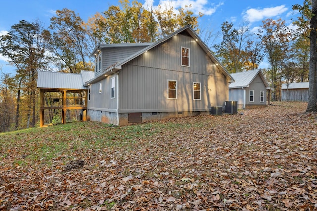 back of property with central AC unit