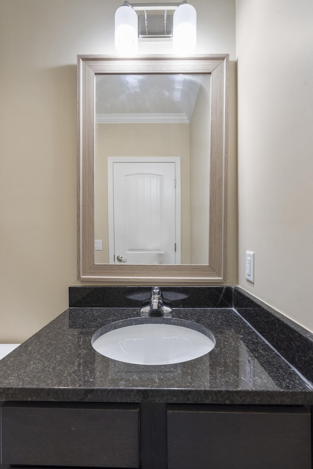 bathroom featuring vanity and crown molding