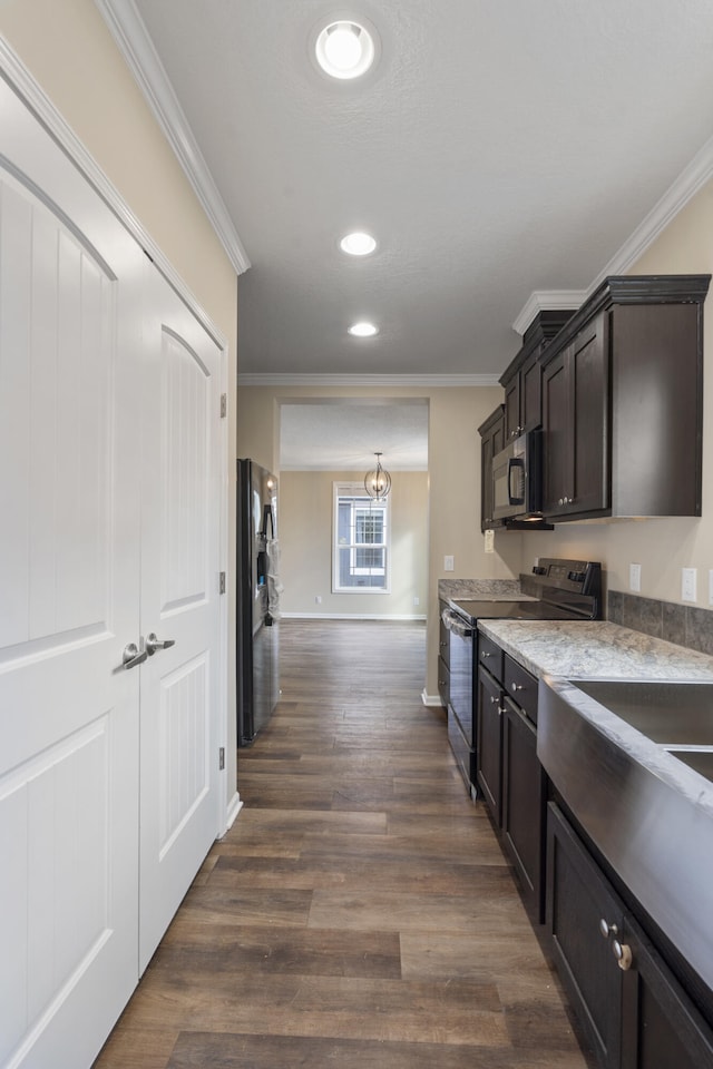 kitchen with dark hardwood / wood-style floors, refrigerator, crown molding, and black range with electric cooktop