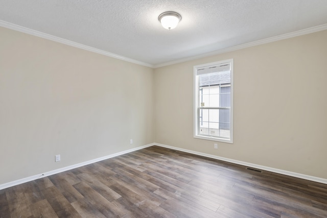 unfurnished room featuring dark hardwood / wood-style floors, ornamental molding, and a textured ceiling