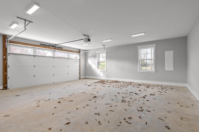 garage with electric panel and a garage door opener