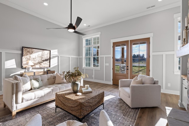 living room with crown molding, french doors, ceiling fan, and hardwood / wood-style flooring