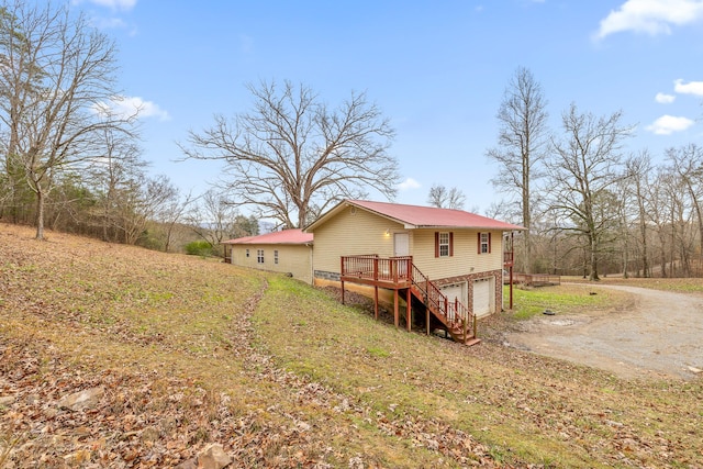 exterior space with a deck and a garage