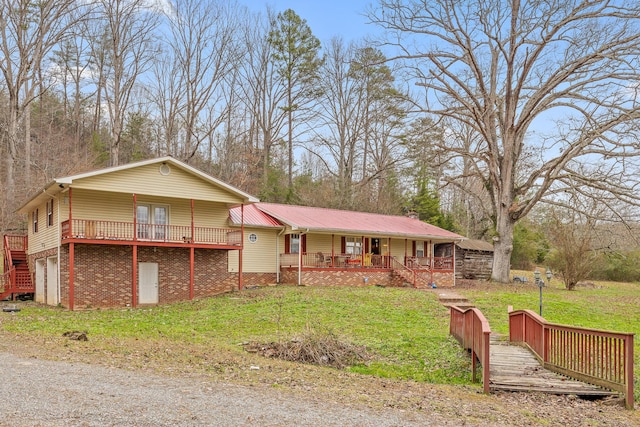 view of front of home featuring covered porch and a front yard