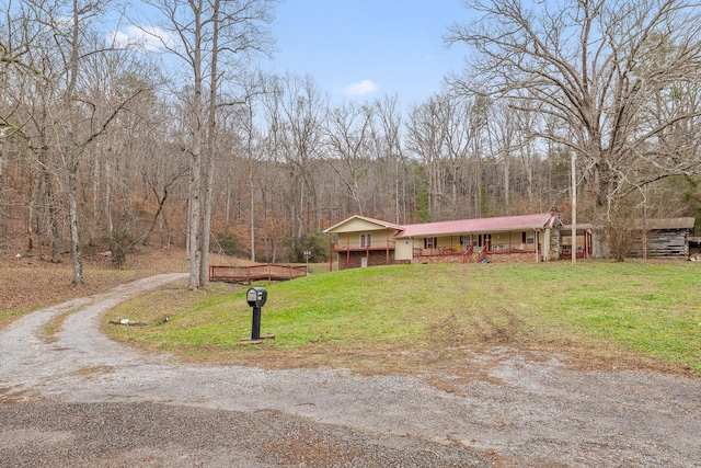 ranch-style house featuring a front lawn