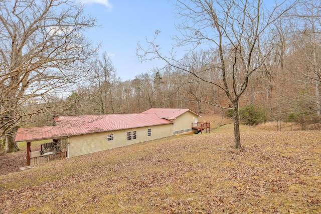 view of side of property with a wooden deck