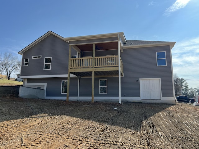 back of property featuring a balcony