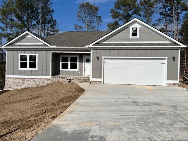 ranch-style home featuring a garage