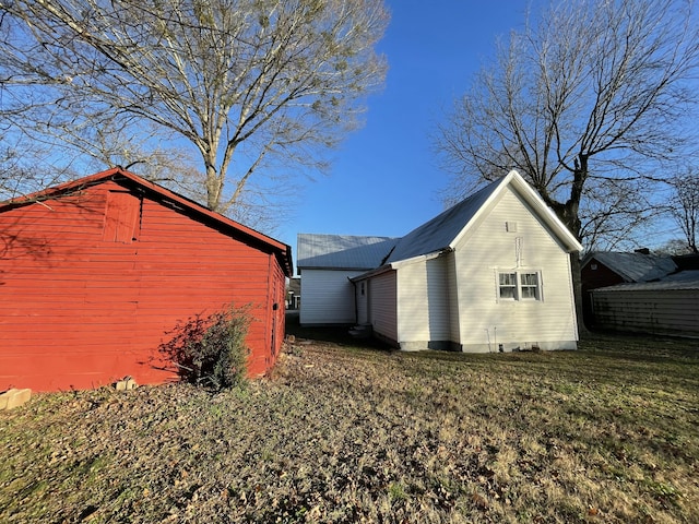 view of home's exterior featuring a lawn