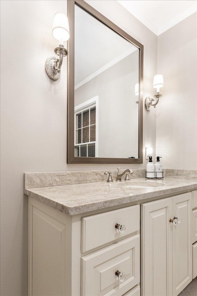 bathroom with vanity and ornamental molding