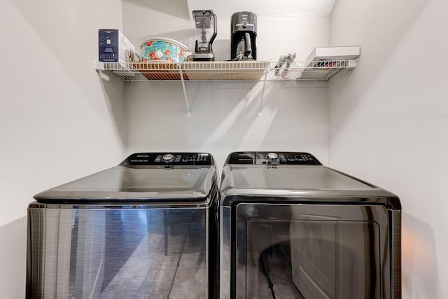 washroom with washer and dryer