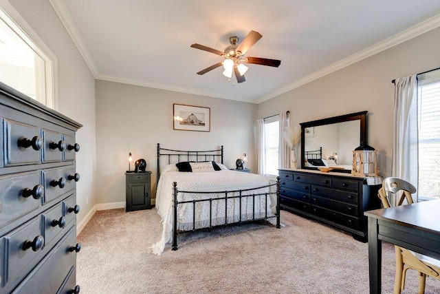 bedroom with ceiling fan, crown molding, and light carpet