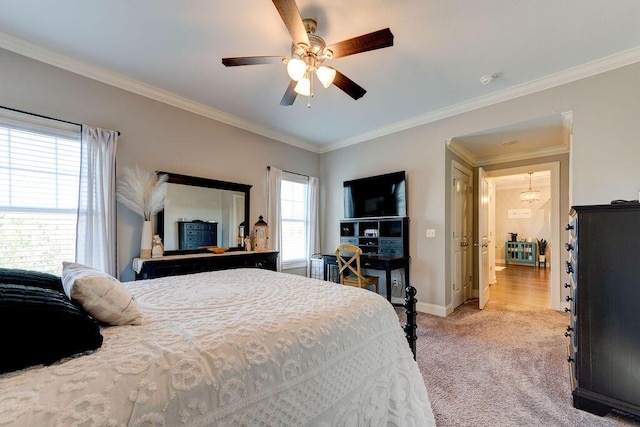 carpeted bedroom featuring ceiling fan and ornamental molding