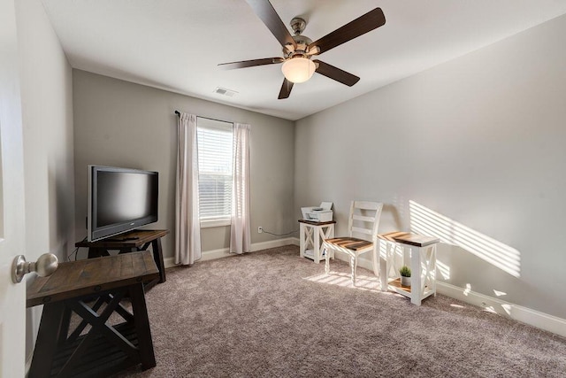 interior space with ceiling fan and carpet floors