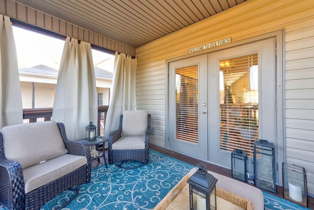 exterior space featuring wood walls and wood ceiling