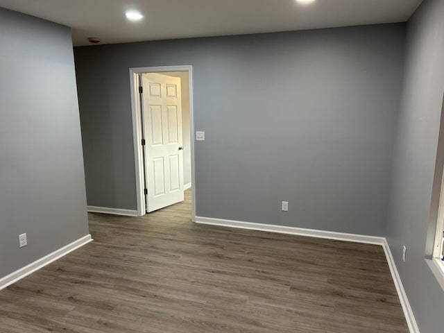 unfurnished room featuring hardwood / wood-style floors