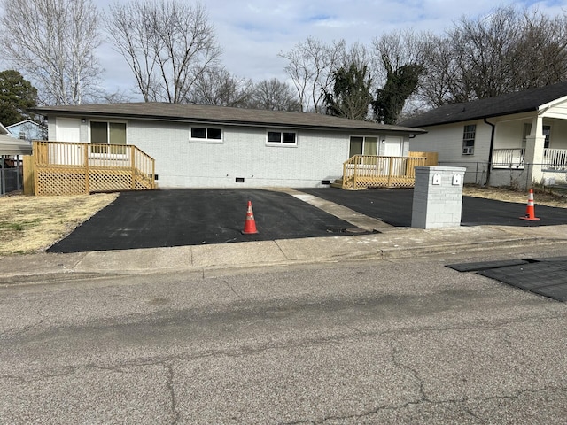 view of front of house with a wooden deck