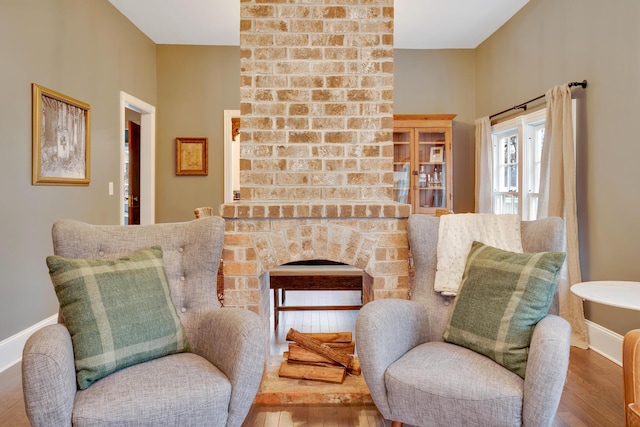 sitting room with hardwood / wood-style floors