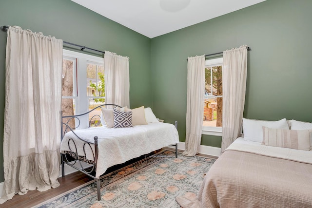 bedroom with wood-type flooring