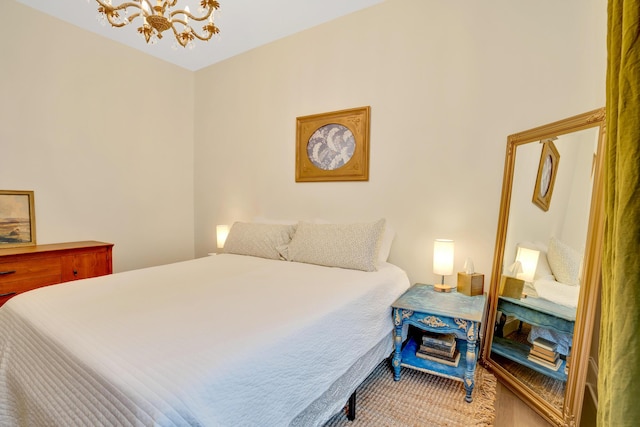 bedroom with a notable chandelier