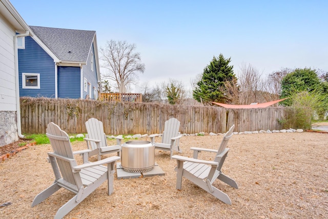 view of yard with an outdoor fire pit