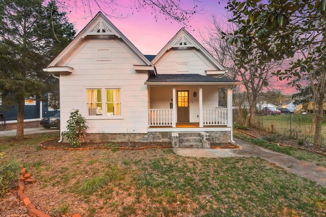 view of front of property with a yard and a porch