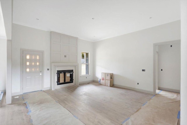 unfurnished living room with light wood-type flooring