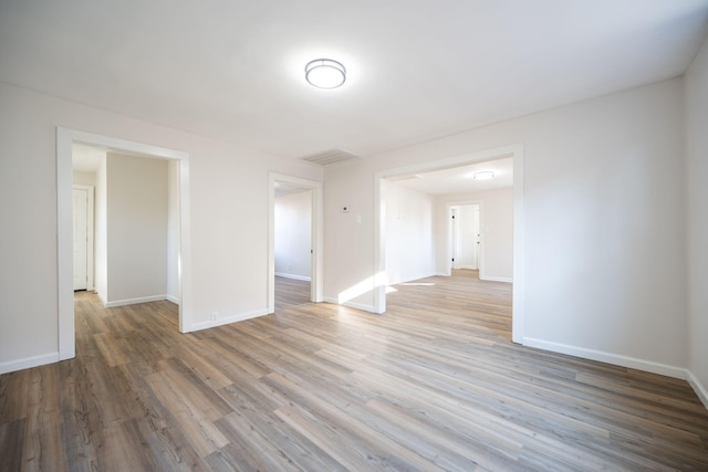 spare room with light hardwood / wood-style flooring