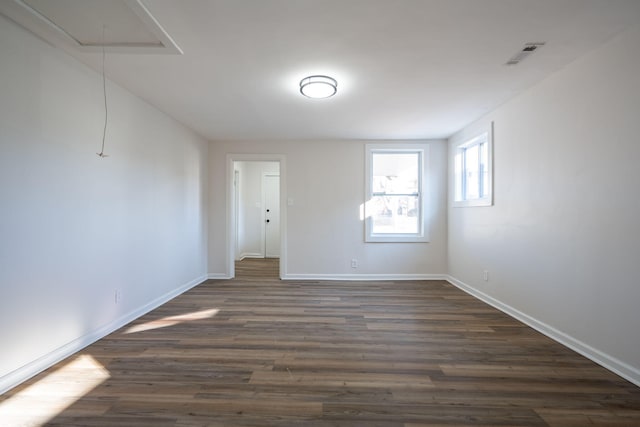 spare room featuring dark hardwood / wood-style floors