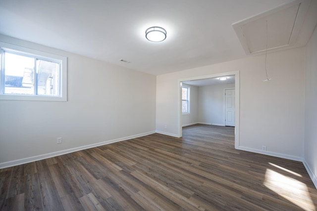 spare room featuring dark hardwood / wood-style flooring