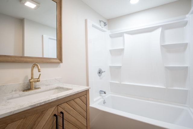 bathroom featuring vanity and shower / bath combination