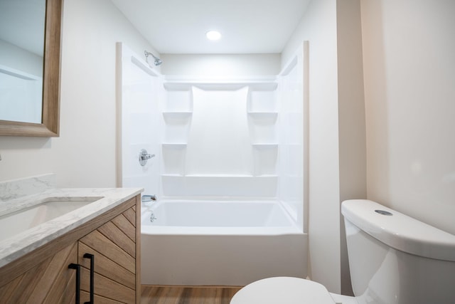 full bathroom with vanity, wood-type flooring, shower / bathtub combination, and toilet