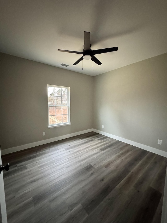 unfurnished room featuring ceiling fan and dark hardwood / wood-style floors