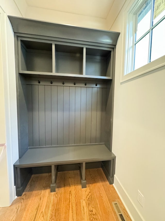 mudroom with light hardwood / wood-style floors