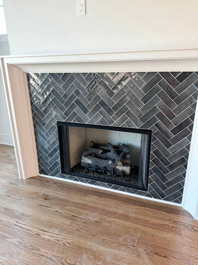 details with a tiled fireplace