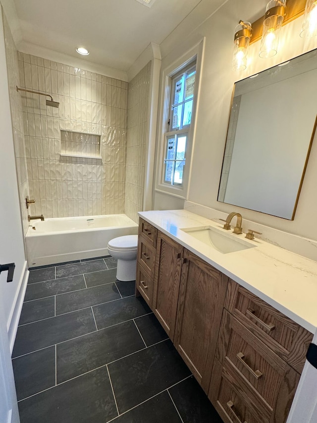 full bathroom with vanity, toilet, and tiled shower / bath