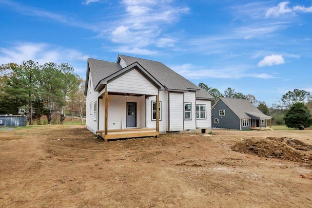 back of house with a porch