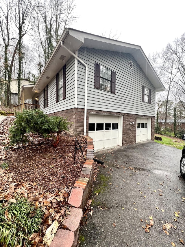 view of property exterior with a garage