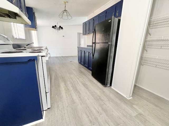 kitchen with black refrigerator, blue cabinets, light wood-type flooring, a notable chandelier, and range