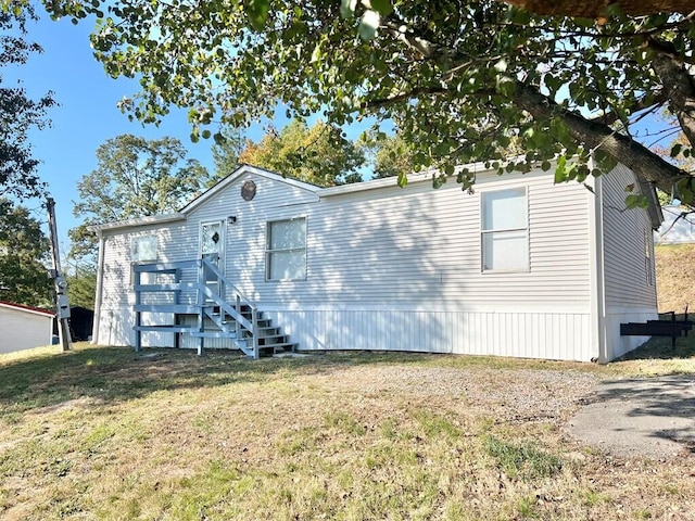 view of home's exterior with a yard