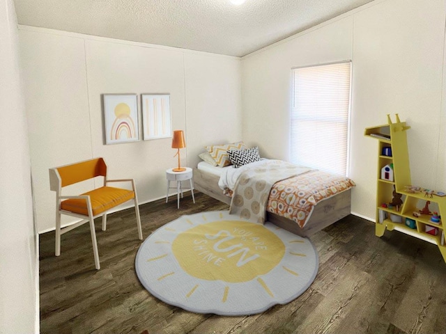 bedroom with a textured ceiling, dark hardwood / wood-style flooring, crown molding, and lofted ceiling