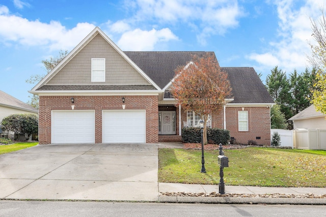 view of front facade with a garage and a front yard