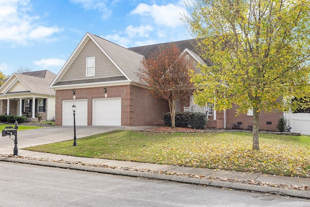 view of front of home featuring a garage and a front yard