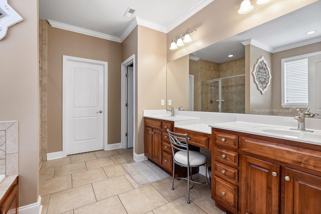 bathroom featuring tile patterned floors, vanity, an enclosed shower, and crown molding