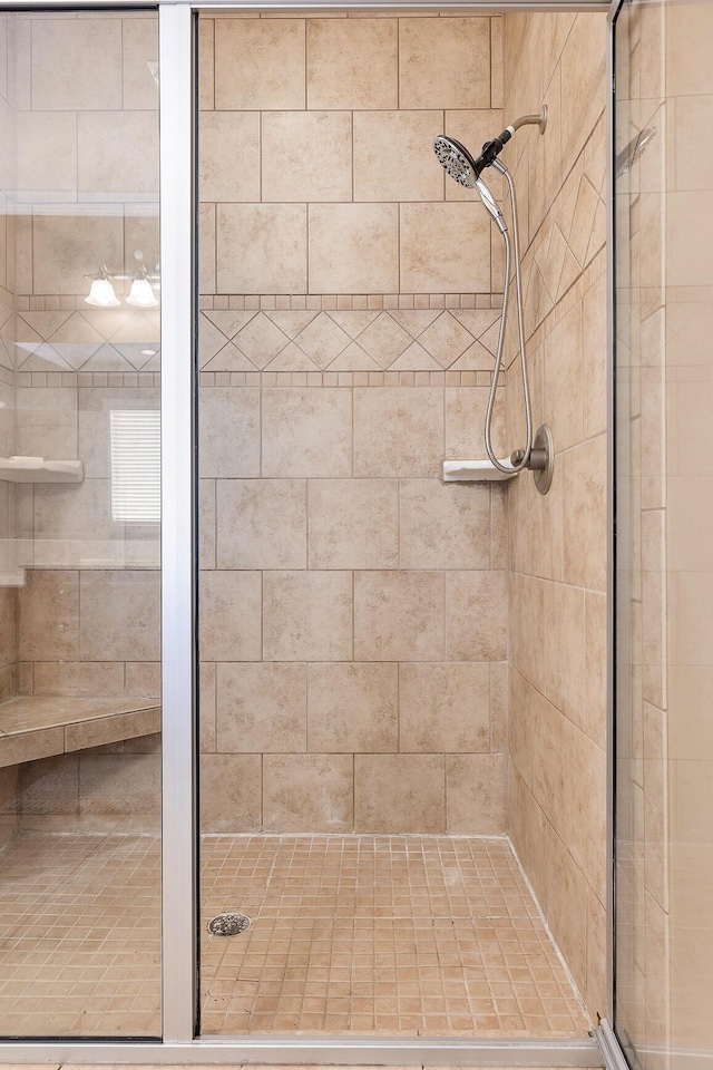 bathroom featuring a shower with door