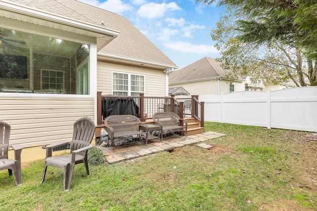 view of yard with a patio area and a wooden deck