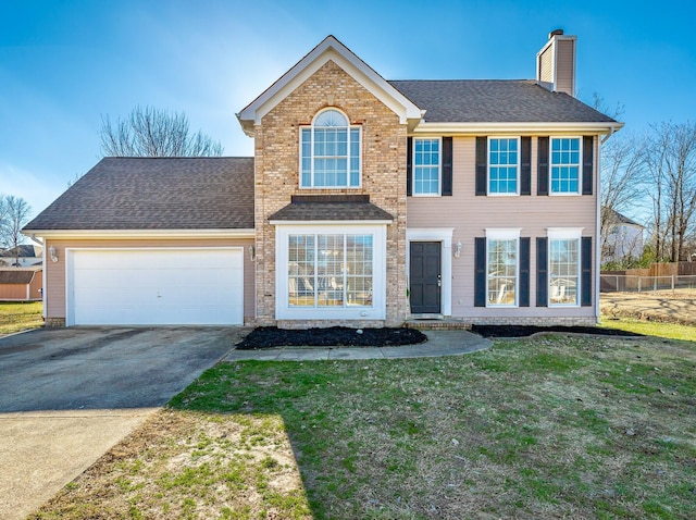 view of front facade with a front lawn and a garage