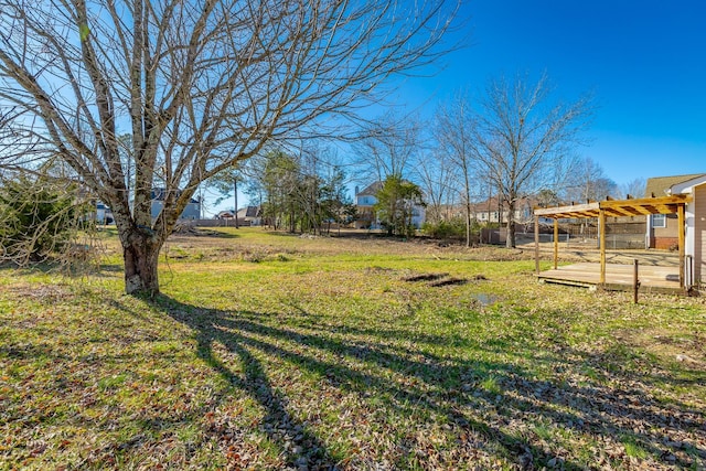 view of yard with a wooden deck