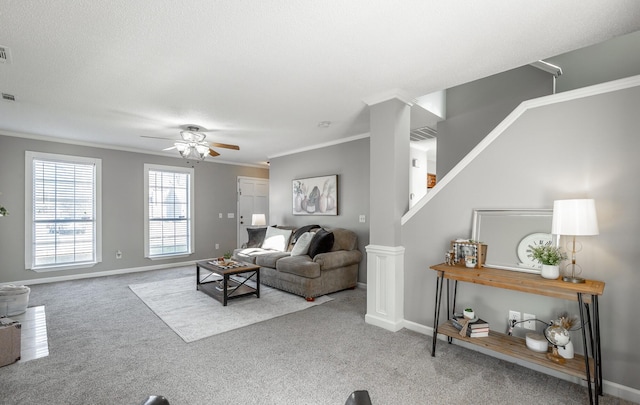 living room with crown molding, carpet, and ceiling fan