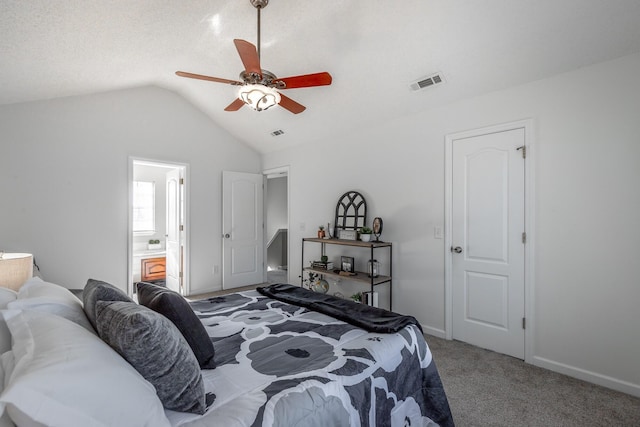 carpeted bedroom with connected bathroom, ceiling fan, and lofted ceiling